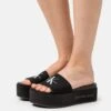 Calvin Klein Jeans Flatform Monogram - Heeled Mules